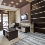 Imagen de un salón contemporáneo con suelo vinílico autoadhesivo en acabado gris medio.